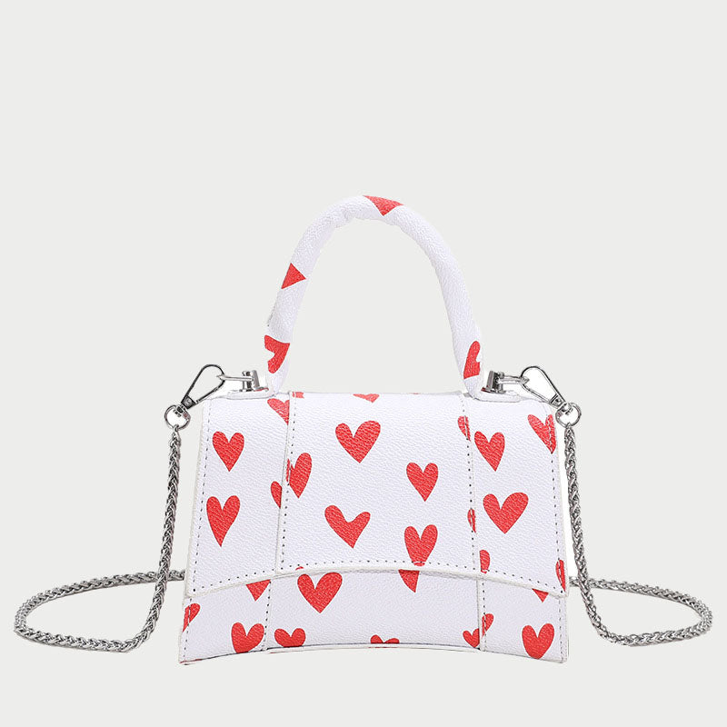 Women’s Small Heart Print Top Handle Bags in Vegan Leather image