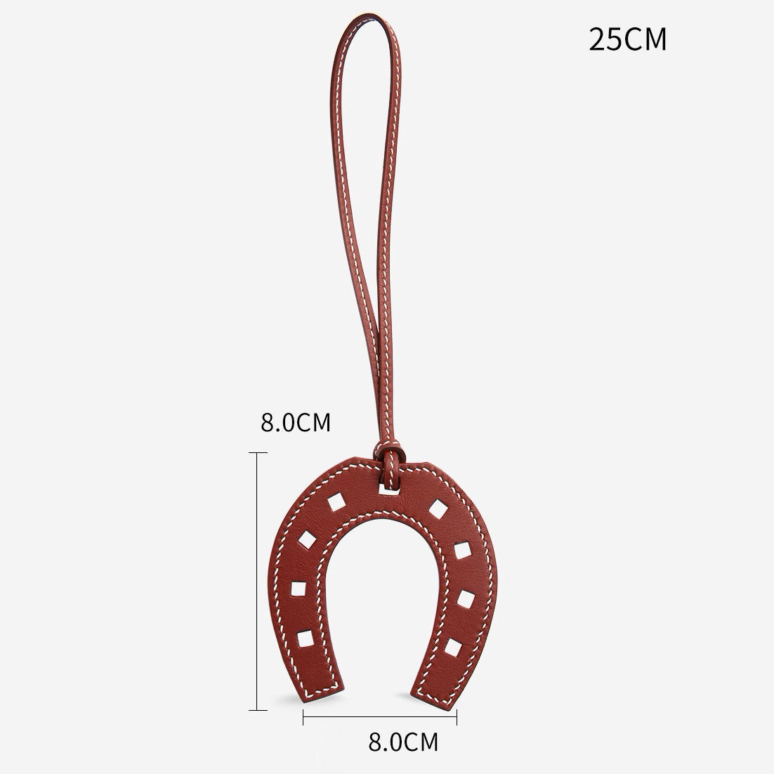 The horseshoe pendant keychain, made of genuine leather, is a high-end accessory suitable for various fashion bags, as well as a handmade car charm