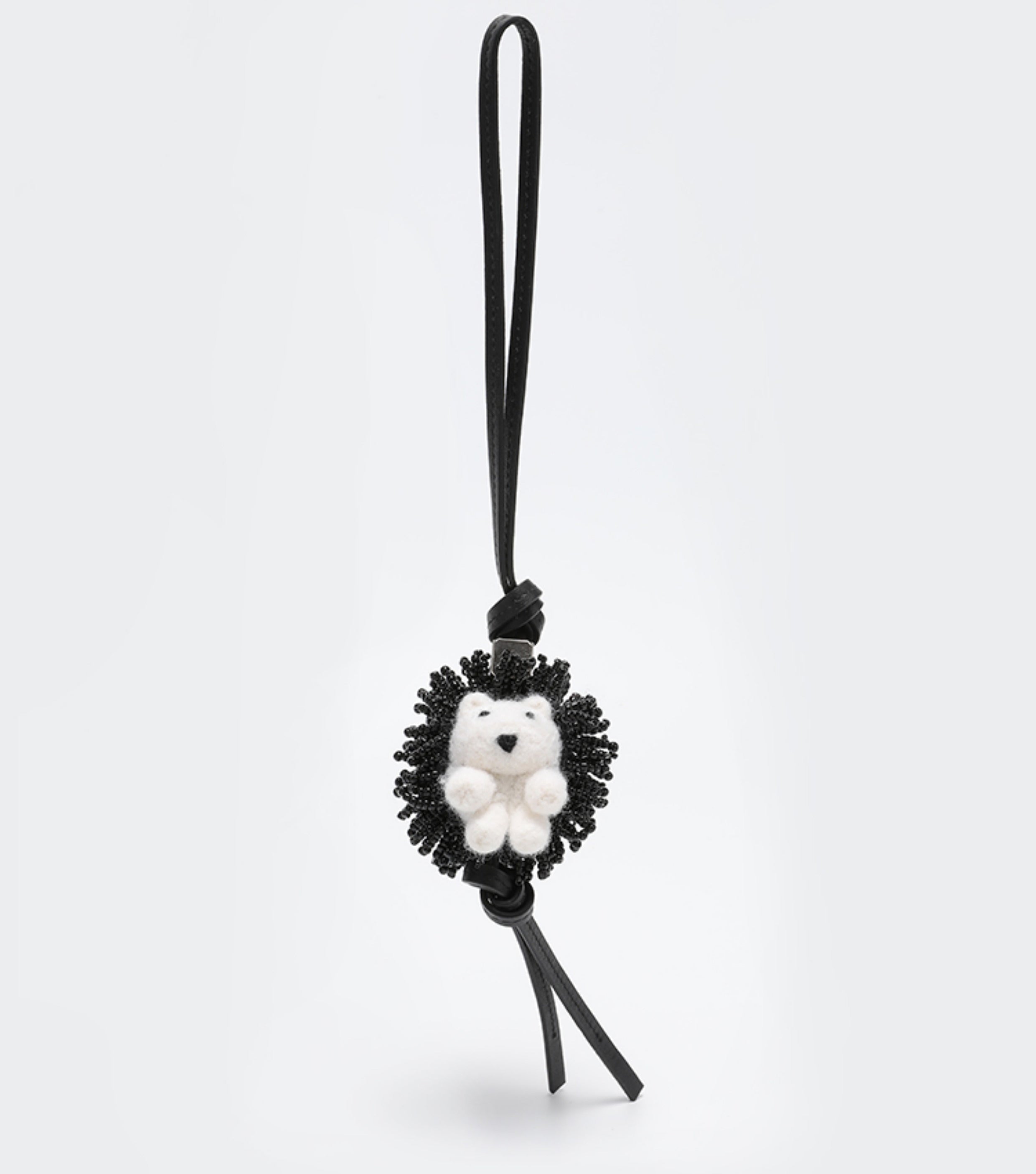 A fashionable handbag charm, handmade from genuine leather, featuring a cute animal design. It can be used as a keychain or a car accessory