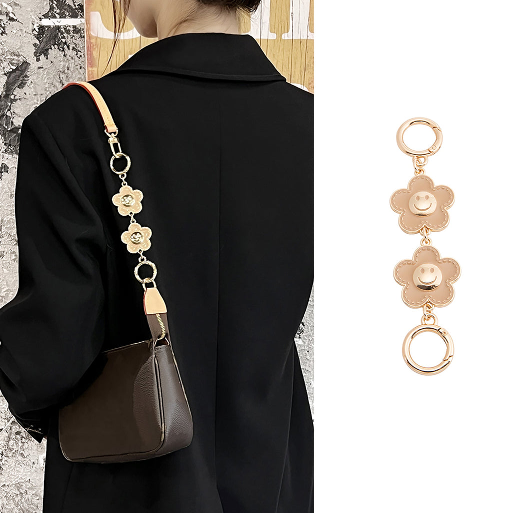 Metal accessory for underarm bags with a flower and smiley face design, 15 cm long strap extension chain