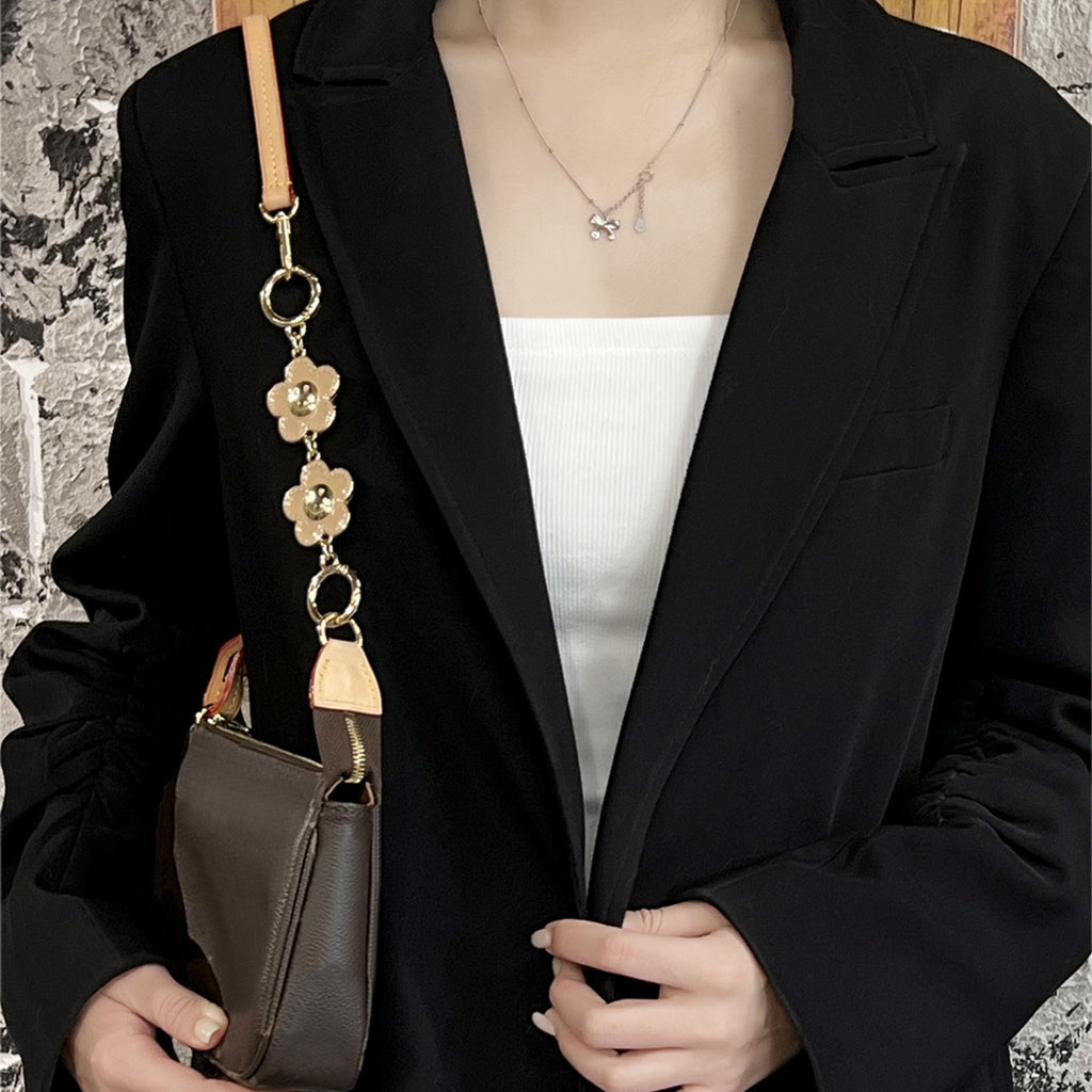Metal accessory for underarm bags with a flower and smiley face design, 15 cm long strap extension chain
