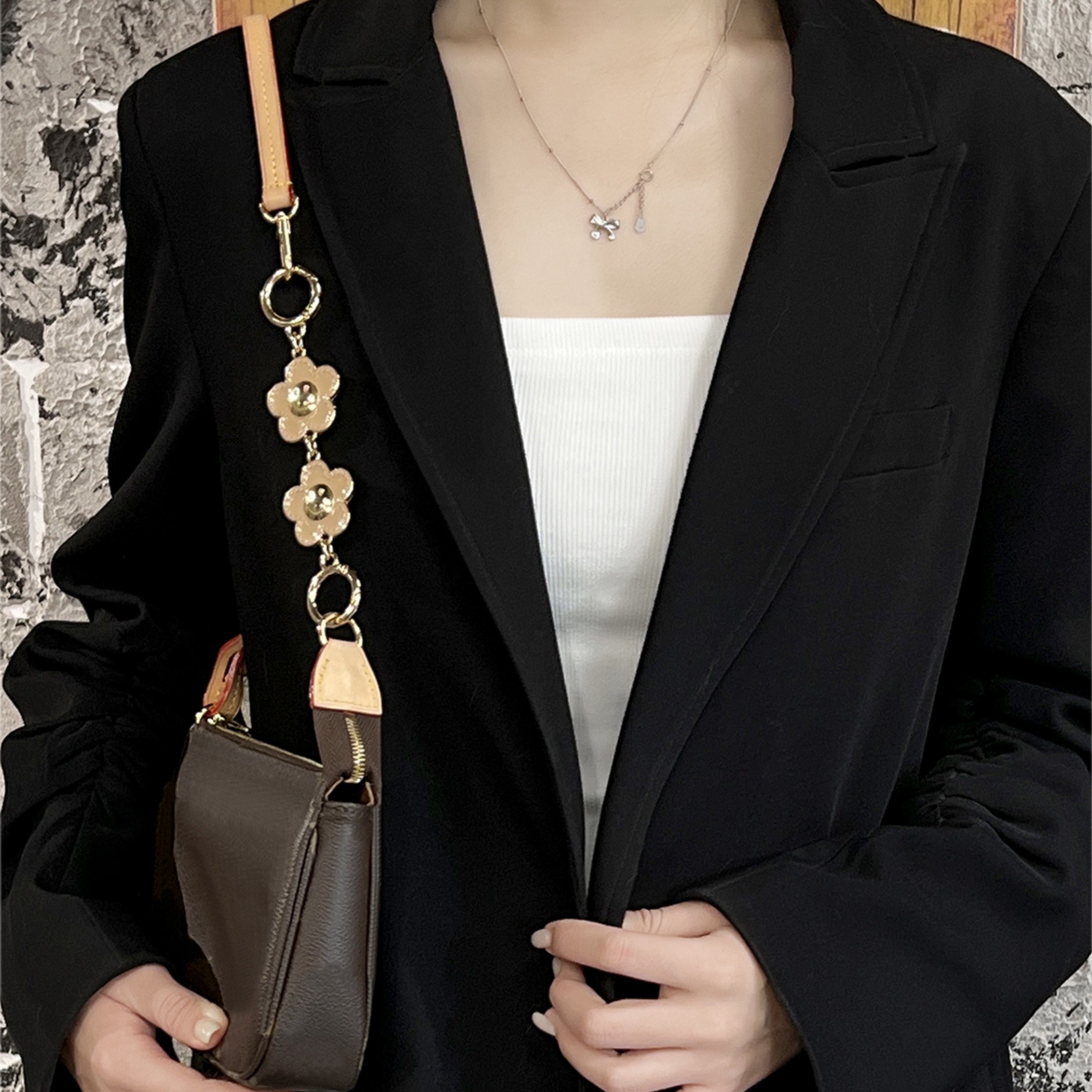 Metal accessory for underarm bags with a flower and smiley face design, 15 cm long strap extension chain