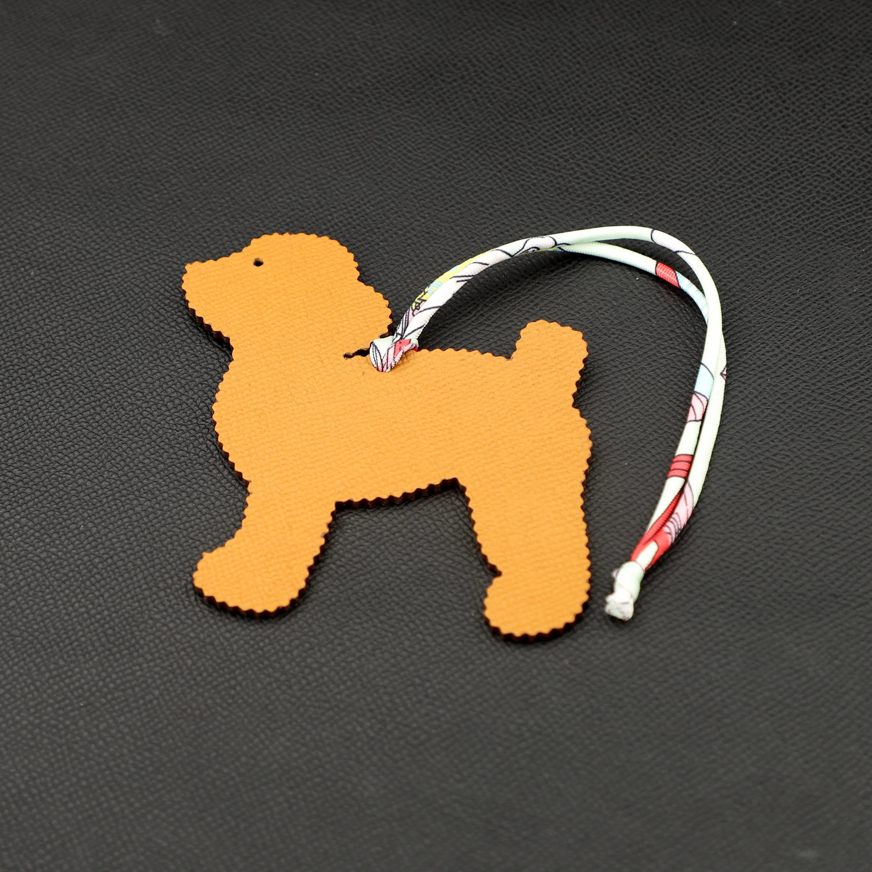 Smiling Cute Poodle Dog bag charm,one side in epsom leather , other side in togo leather ,Leather bag charm, Handmade leather bag charm