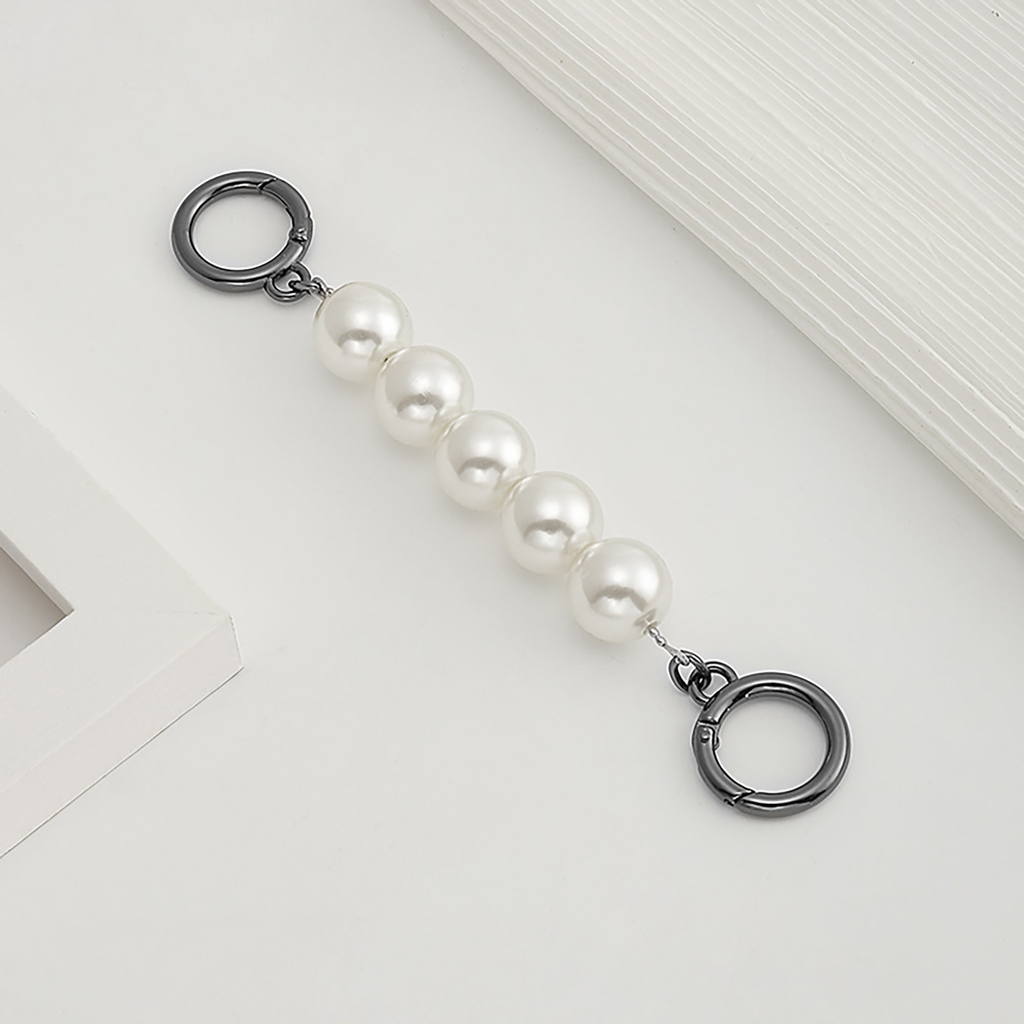 Underarm bag strap extension accessory, pearl extension chain, metal chain strap modification for bags.