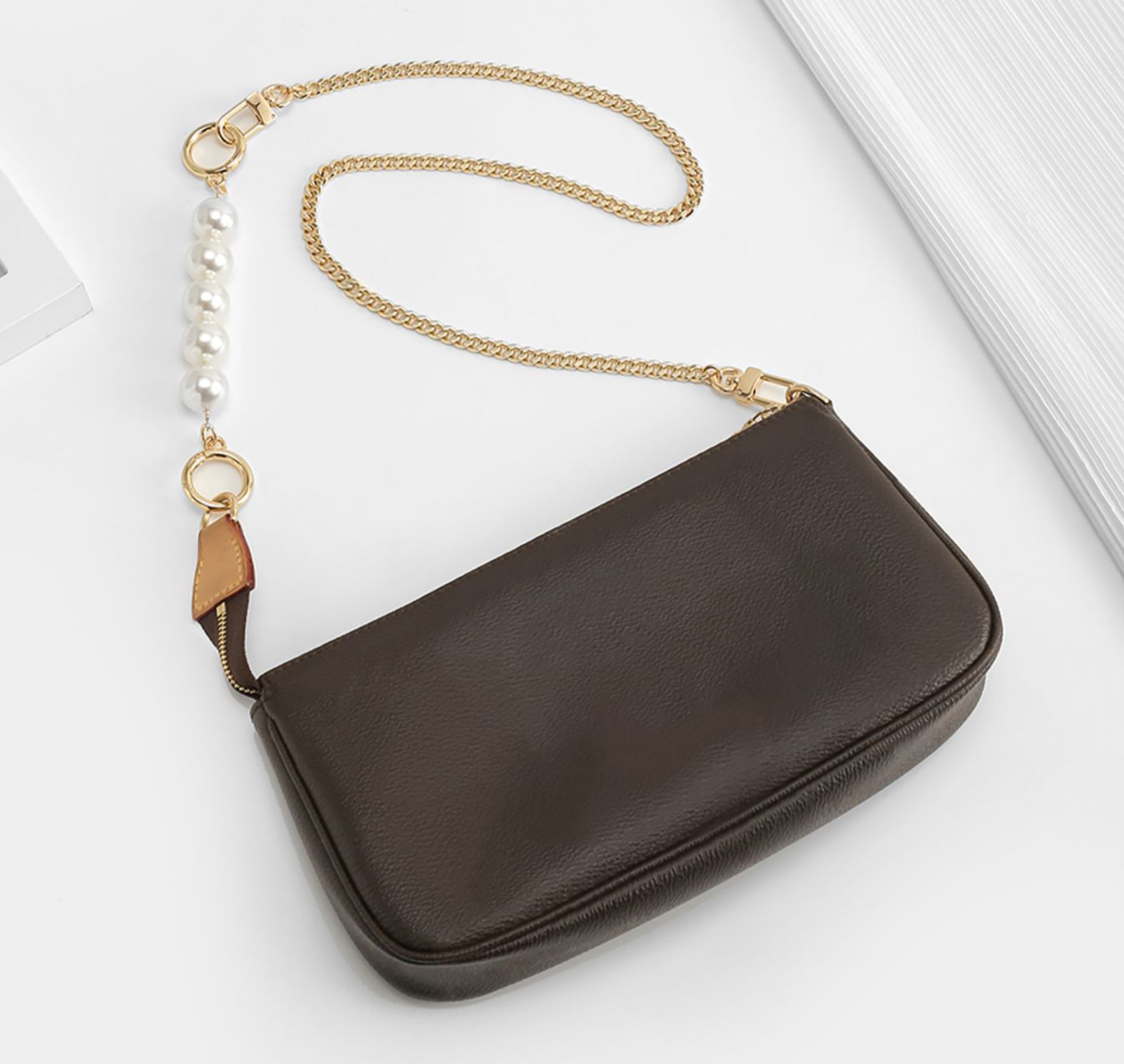 Underarm bag strap extension accessory, pearl extension chain, metal chain strap modification for bags.