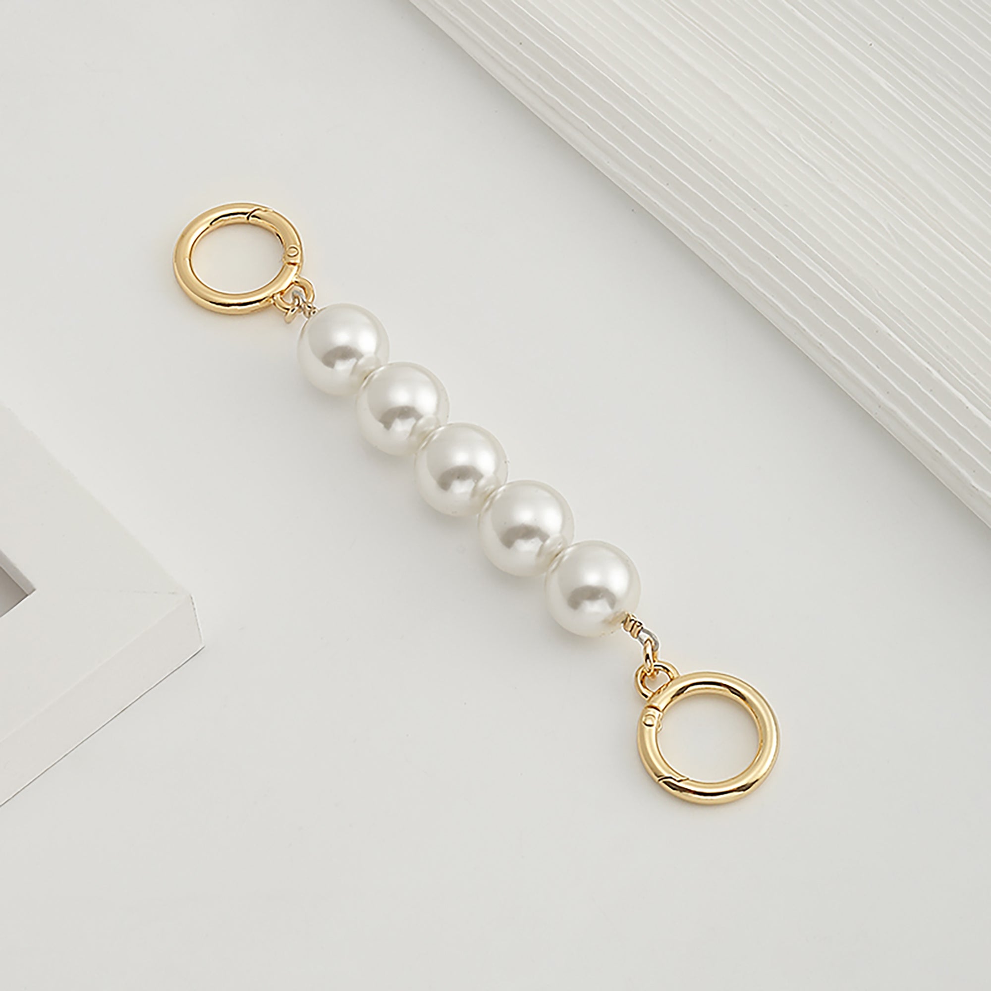 Underarm bag strap extension accessory, pearl extension chain, metal chain strap modification for bags.
