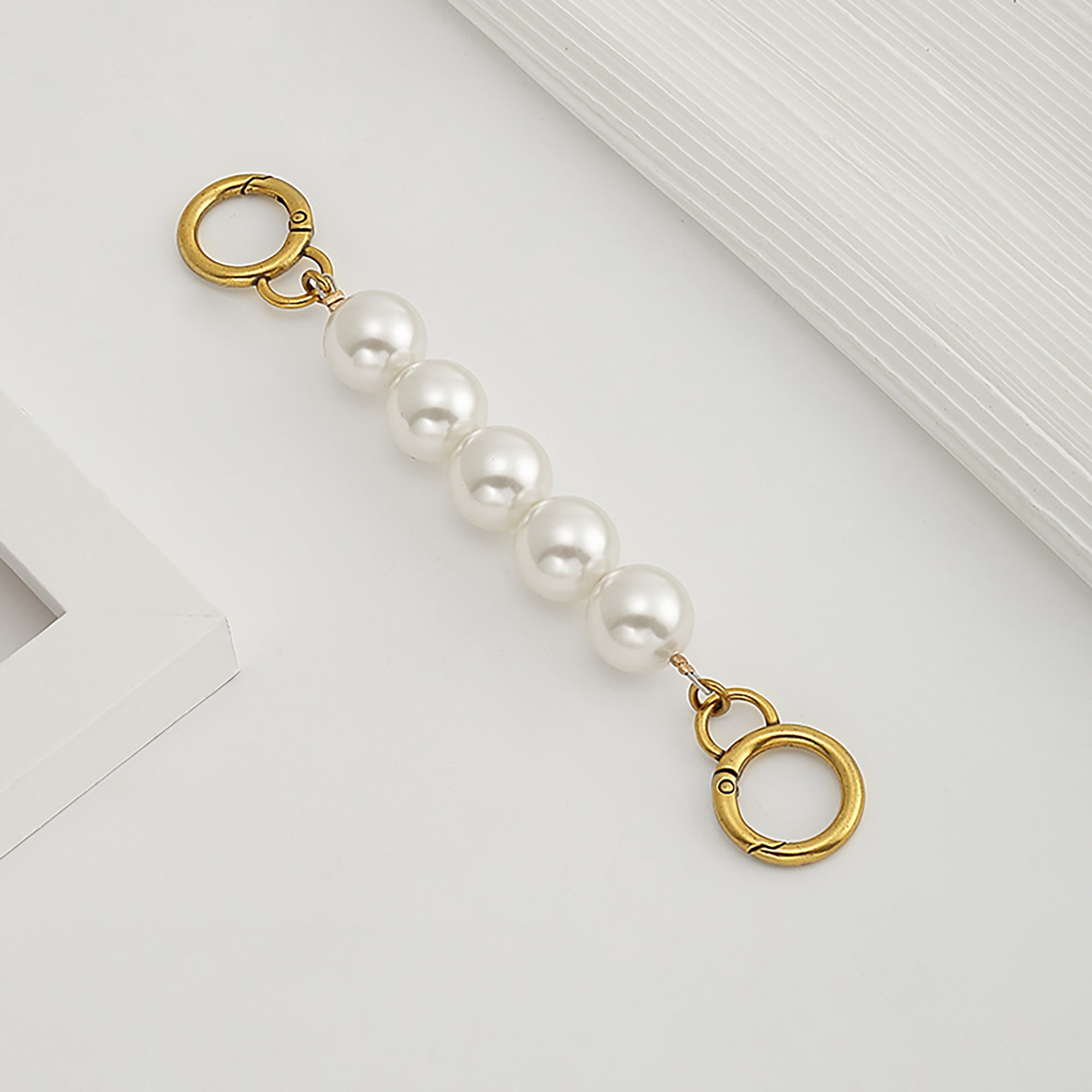 Underarm bag strap extension accessory, pearl extension chain, metal chain strap modification for bags.