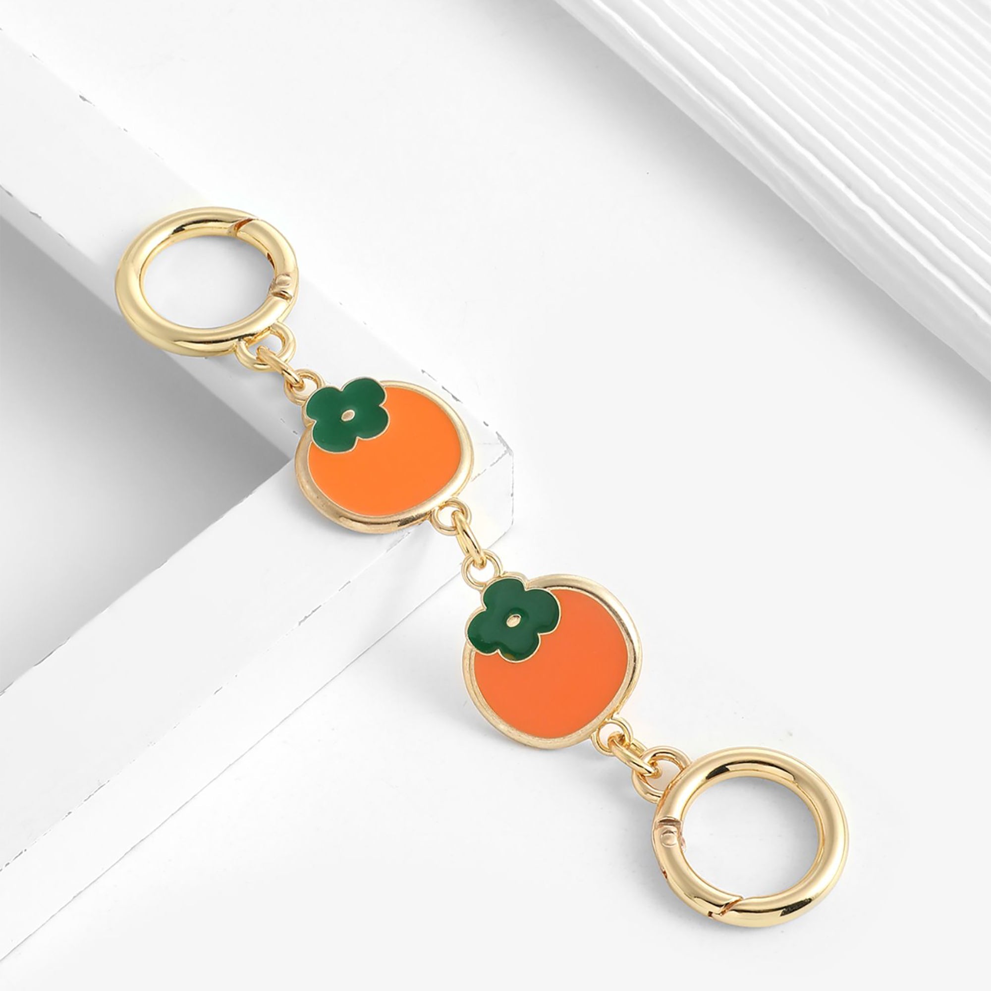 The extension chain is suitable for the Monogram Pochette Accessoires. The strap modification features a persimmon-colored metal short chain extension accessory
