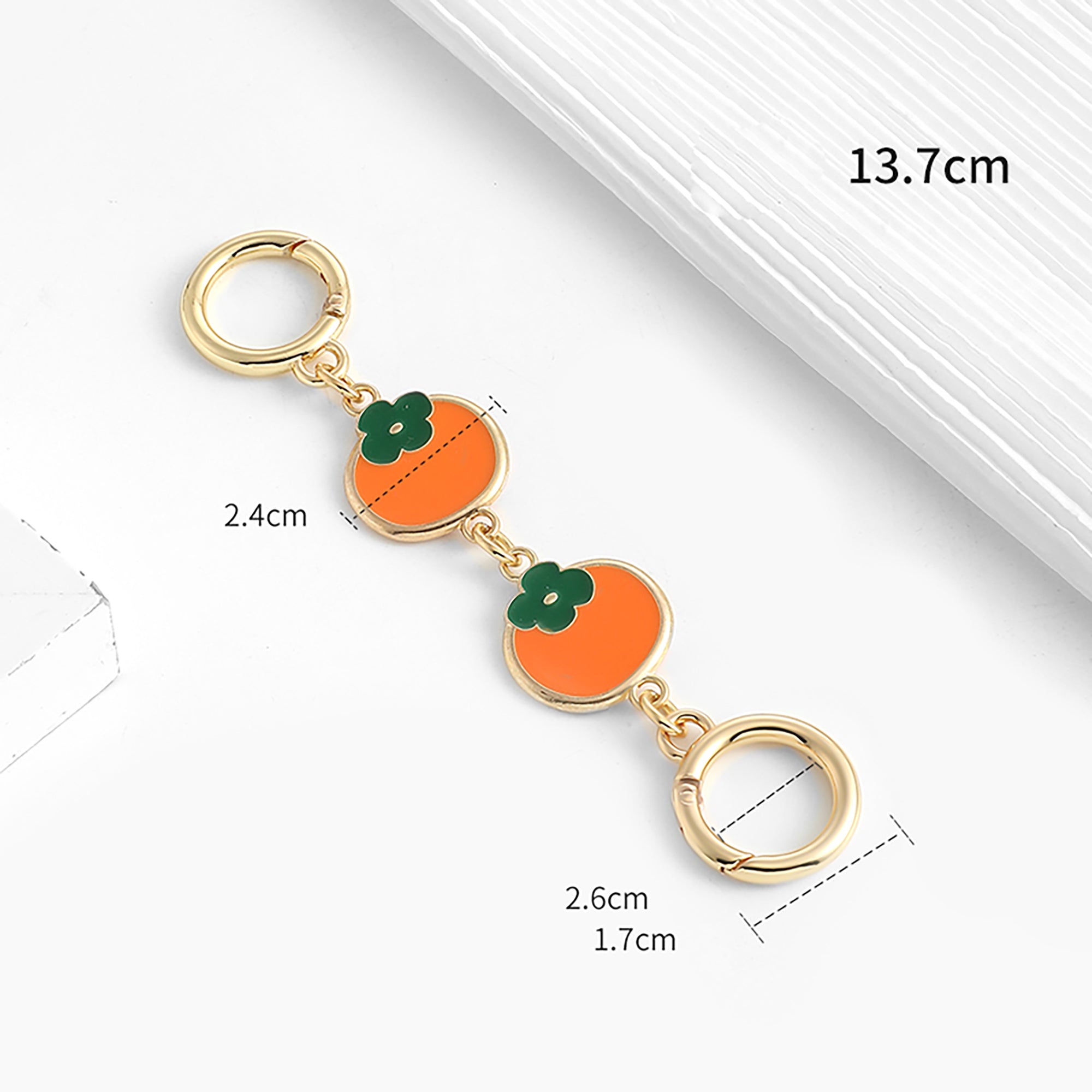 The extension chain is suitable for the Monogram Pochette Accessoires. The strap modification features a persimmon-colored metal short chain extension accessory