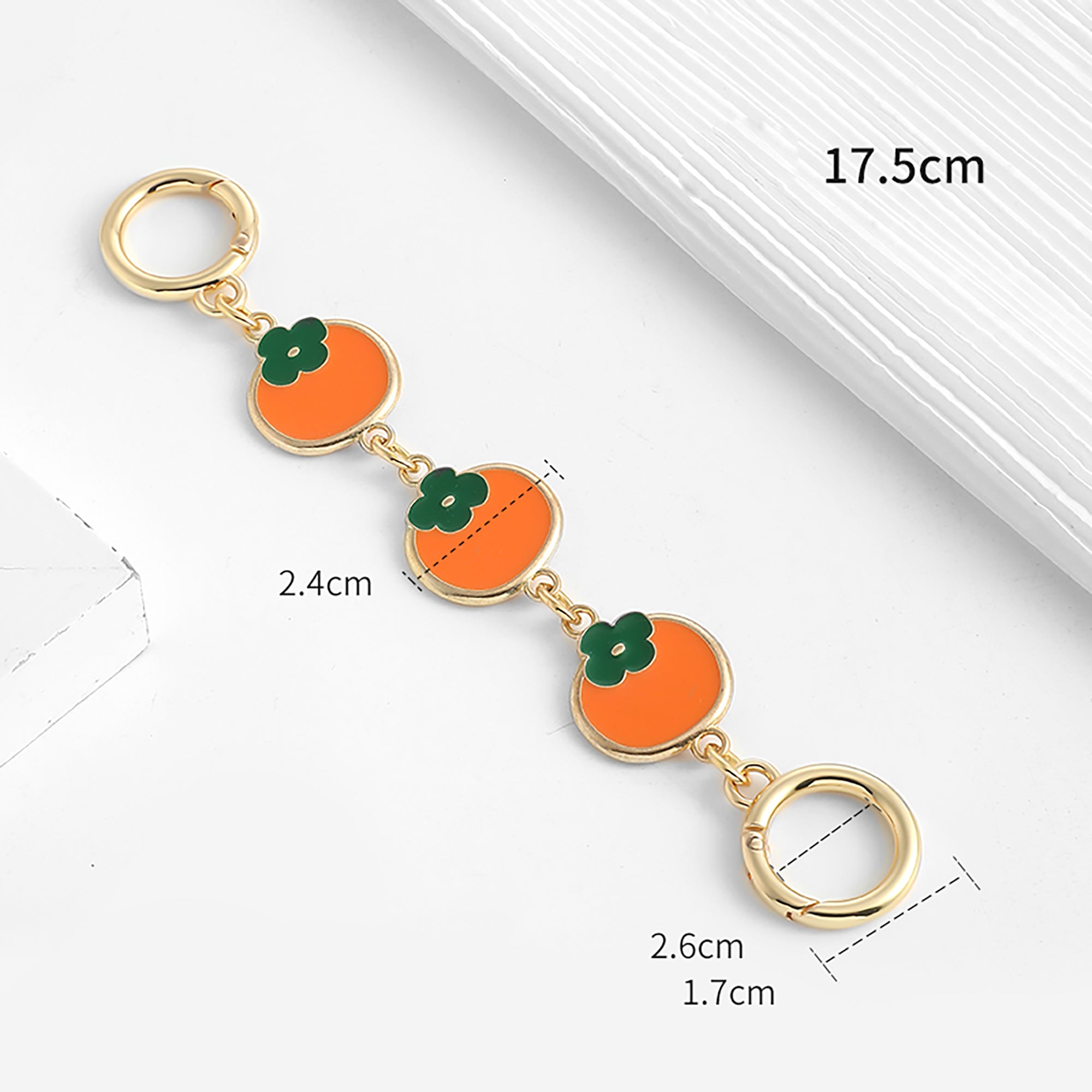 The extension chain is suitable for the Monogram Pochette Accessoires. The strap modification features a persimmon-colored metal short chain extension accessory